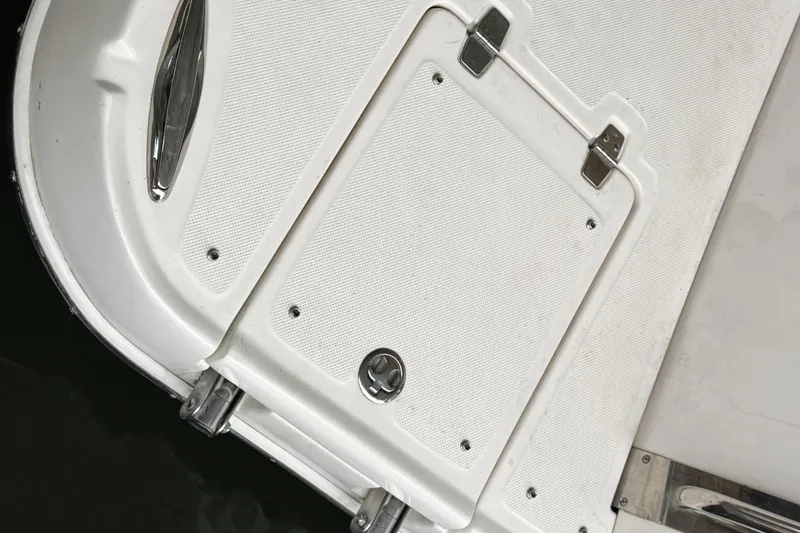 Slide: The Image of 2006 Regal Commodore 3560 IO boat deck with hatch and metal fittings. - 22