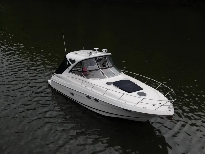 Slide: The Image of 2006 Regal Commodore 3560 IO boat on calm water, aerial view. - 40