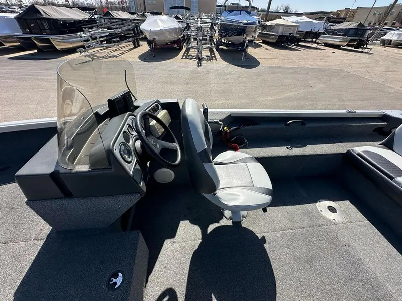 Slide: The Image of 2014 Alumacraft Competitor 175 CS boat interior with steering console and seating. - 9