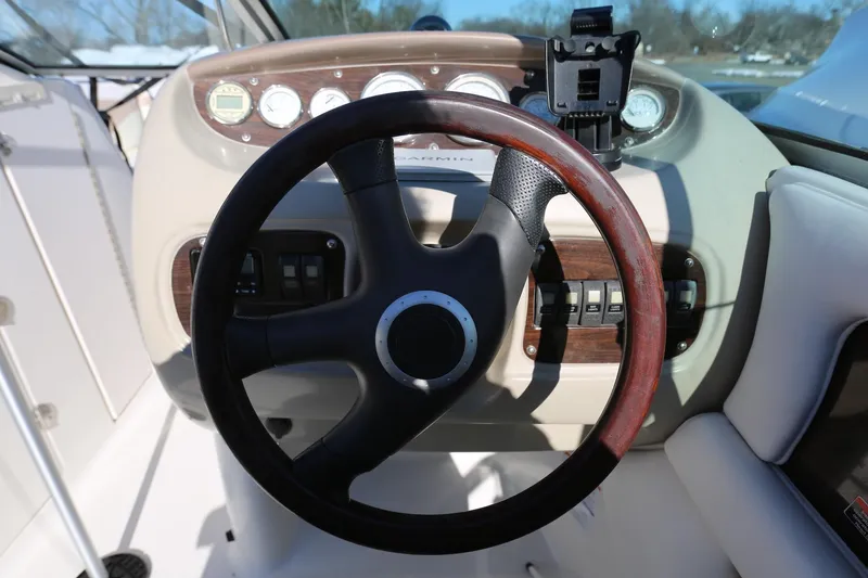 Slide: The Image of 2005 Chaparral 236 Sunesta dashboard with steering wheel and controls. - 11