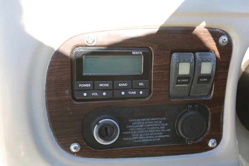 Slide: The Image of Control panel of 2005 Chaparral 236 Sunesta boat with switches and display. - 16