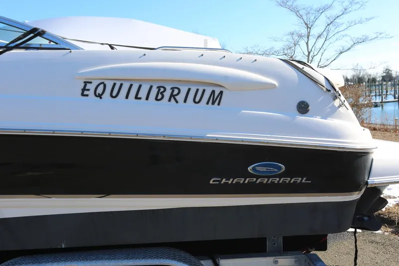 Slide: The Image of 2005 Chaparral 236 Sunesta boat with "Equilibrium" name, on trailer, side view. - 17