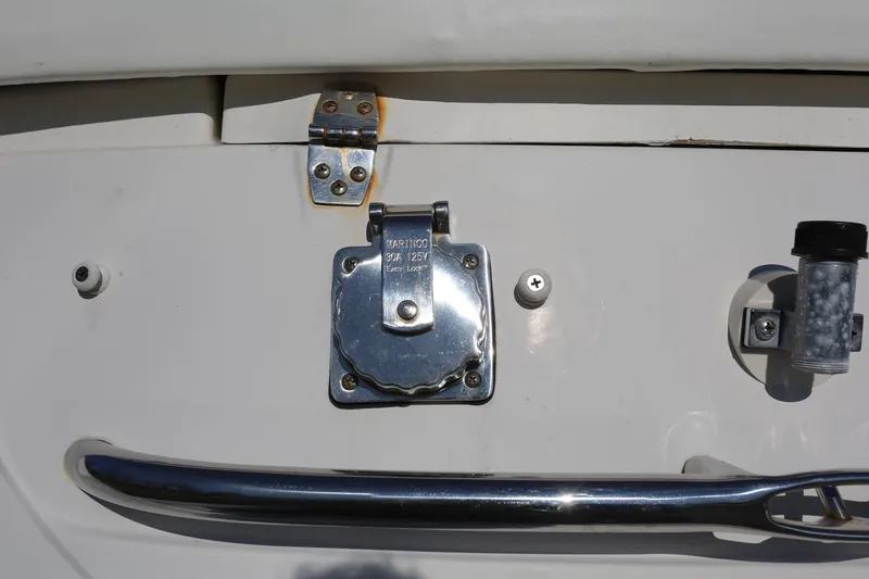 Slide: The Image of Close-up of a 2005 Chaparral 236 Sunesta boat's metal latch and handle. - 19