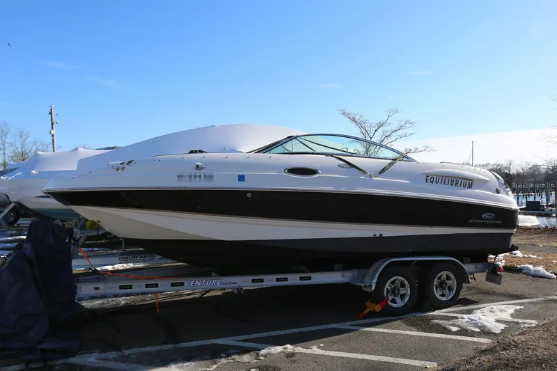 Slide: The Image of 2005 Chaparral 236 Sunesta boat on trailer, side view, outdoors. - 2
