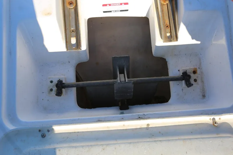 Slide: The Image of 2005 Chaparral 236 Sunesta boat compartment with visible hardware and fittings. - 20