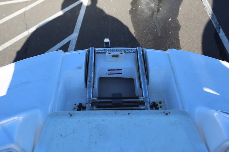 Slide: The Image of 2005 Chaparral 236 Sunesta boat ladder and deck detail. - 21