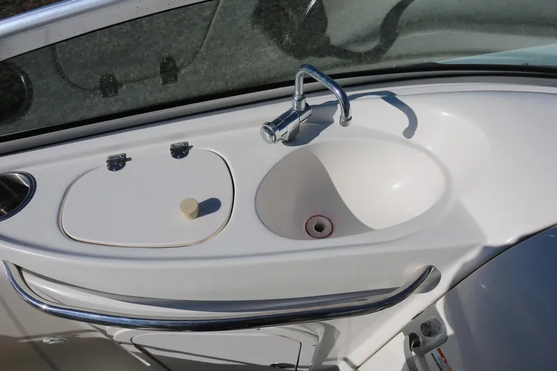 Slide: The Image of 2005 Chaparral 236 Sunesta boat sink and countertop detail. - 23