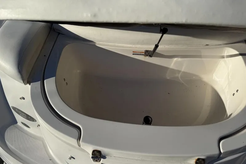 Slide: The Image of Open storage compartment on a 2005 Chaparral 236 Sunesta boat. - 31