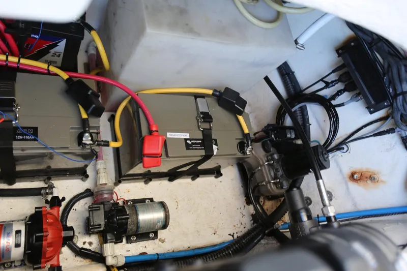 Slide: The Image of Engine compartment of 2005 Chaparral 236 Sunesta with batteries and wiring. - 38