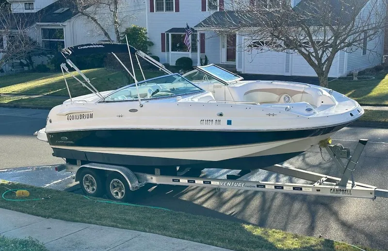 Slide: The Image of 2005 Chaparral 236 Sunesta boat on trailer, parked in residential area. - 4