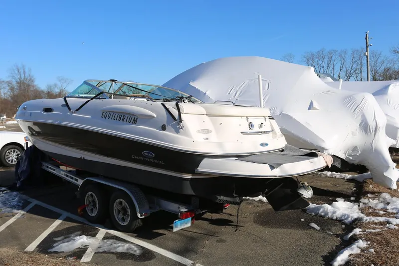 Slide: The Image of 2005 Chaparral 236 Sunesta boat on trailer, parked outdoors in winter setting. - 5