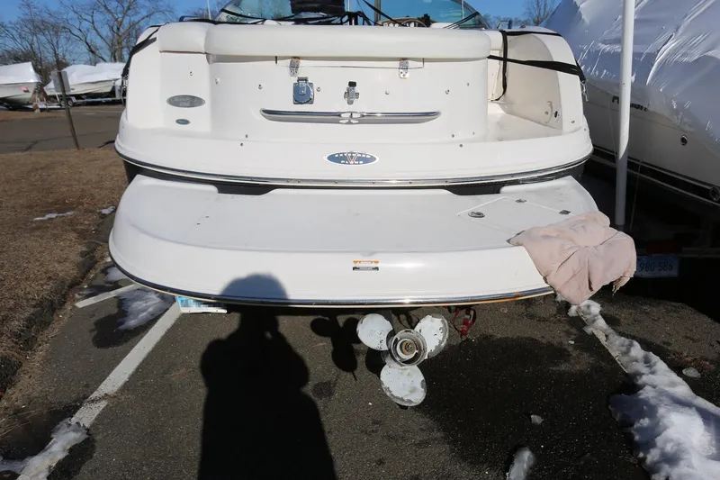 Slide: The Image of 2005 Chaparral 236 Sunesta boat rear view with SeaKeeper and trailer. - 7
