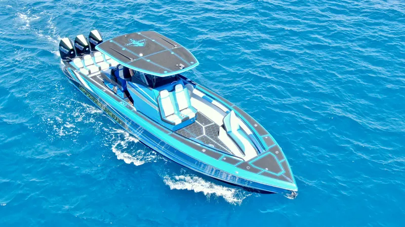 The Image of 2023 Statement 380 Open boat cruising on clear blue water. - 0