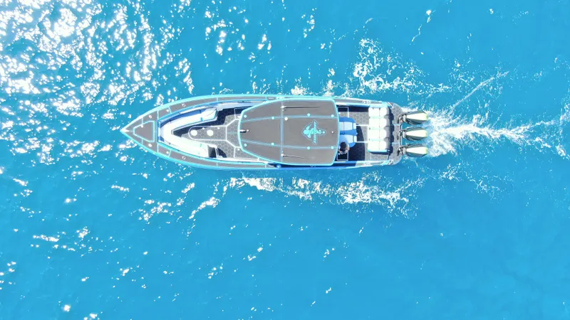 Slide: The Image of Aerial view of 2023 Statement 380 Open boat cruising in clear blue water. - 10