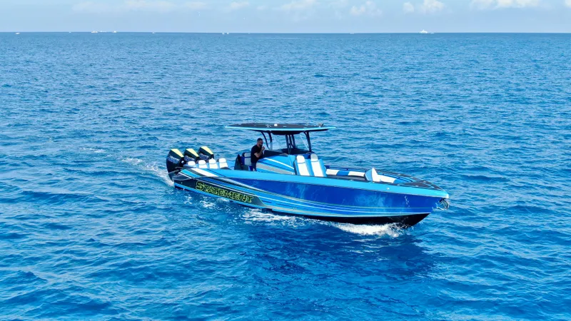 Slide: The Image of 2023 Statement 380 Open boat cruising on open blue ocean waters. - 19