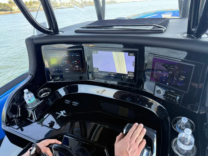 Slide: The Image of Dashboard of 2023 Statement 380 Open boat with navigation screens and controls. - 34
