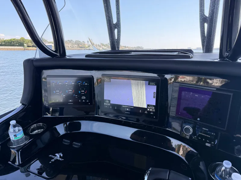 Slide: The Image of Close-up of 2023 Statement 380 Open boat throttle control. - 35