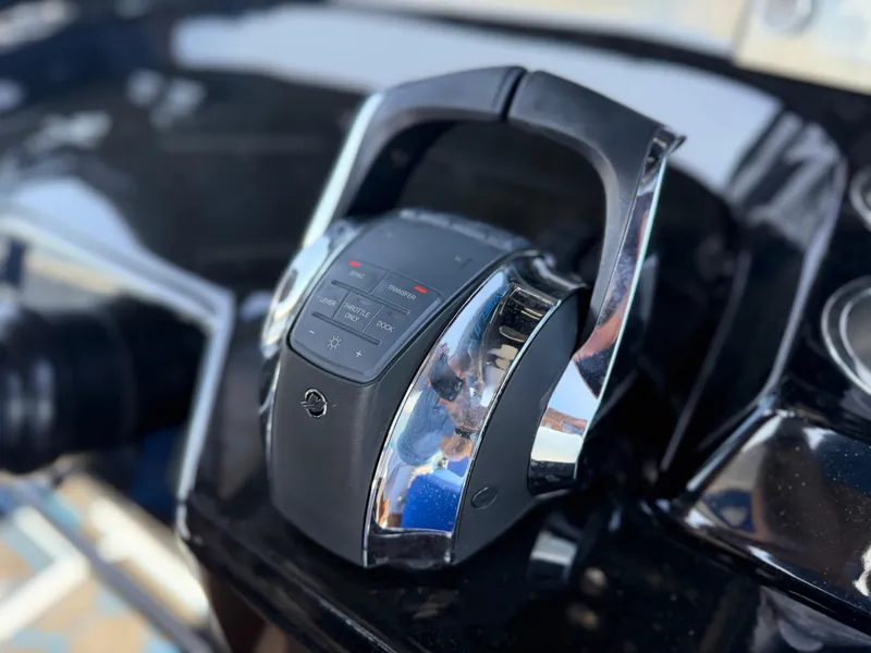 Slide: The Image of Garmin marine display showing weather data and settings on a Statement 380 Open, 2023 model. - 36