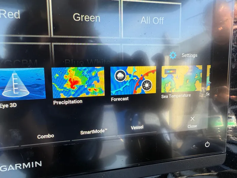 Slide: The Image of Garmin control panel for 2023 Statement 380 Open boat, featuring LED lighting options. - 37