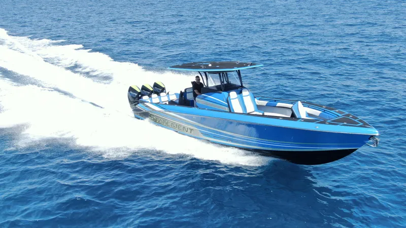 Slide: The Image of 2023 Statement 380 Open boat cruising on blue ocean waters. - 6