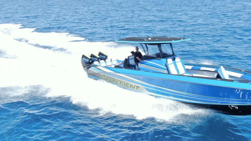 Slide: The Image of 2023 Statement 380 Open boat cruising on blue ocean waters. - 8