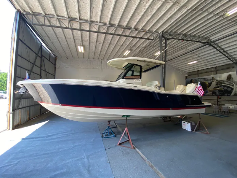 The Image of 2026 Chris-Craft Catalina 28 boat in a spacious indoor storage facility. - 0