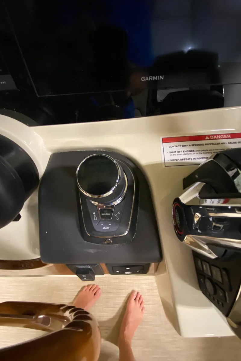 Slide: The Image of 2026 Chris-Craft Catalina 28 helm with wooden steering wheel and modern controls. - 12