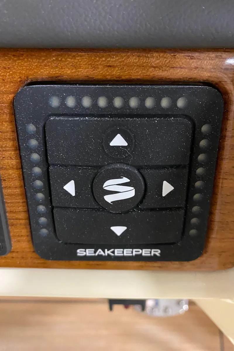 Slide: The Image of 2026 Chris-Craft Catalina 28 helm controls with Garmin display and joystick. - 13