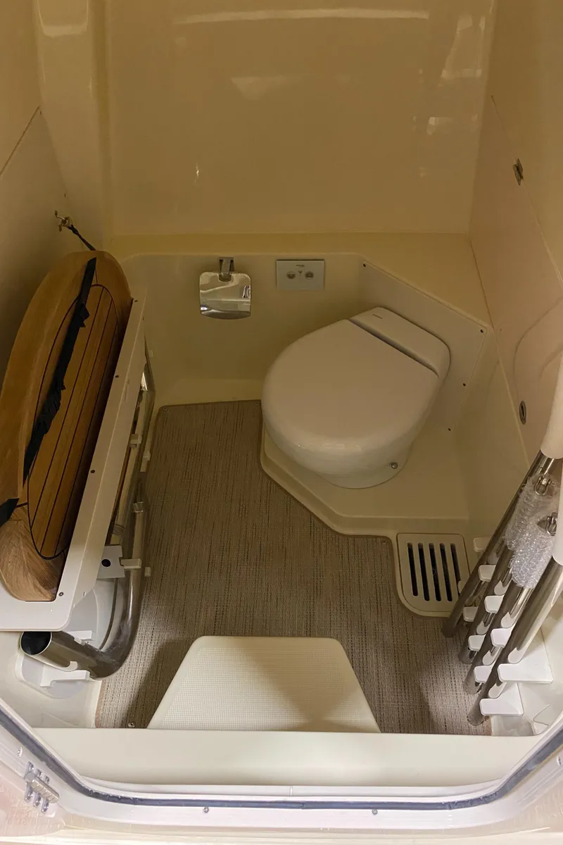 Slide: The Image of Anchor compartment of 2026 Chris-Craft Catalina 28 boat, featuring chain and winch system. - 20