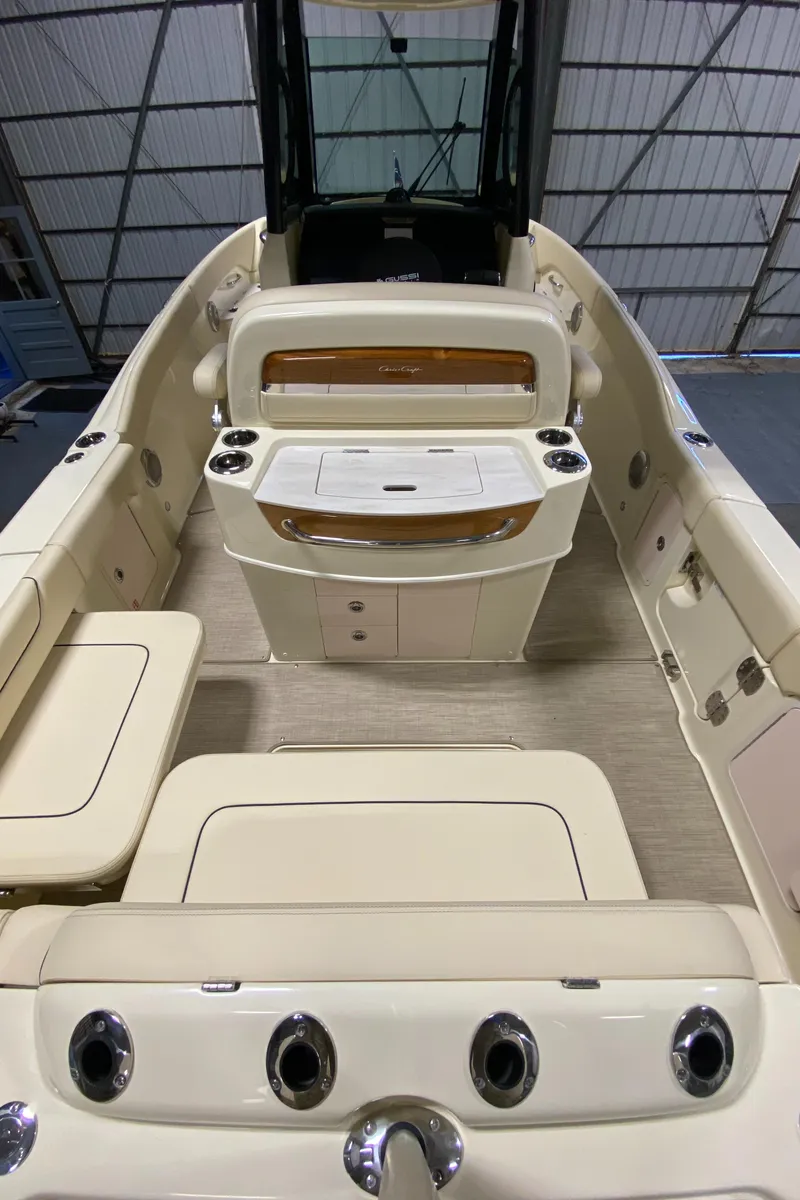 Slide: The Image of 2026 Chris-Craft Catalina 28 with dual outboard engines in a boatyard setting. - 5