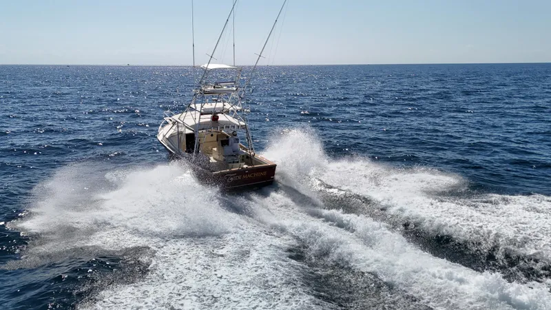 Slide: The Image of Gulf Stream Yachts 1990 31 Tournament cruising on open ocean waters. - 21