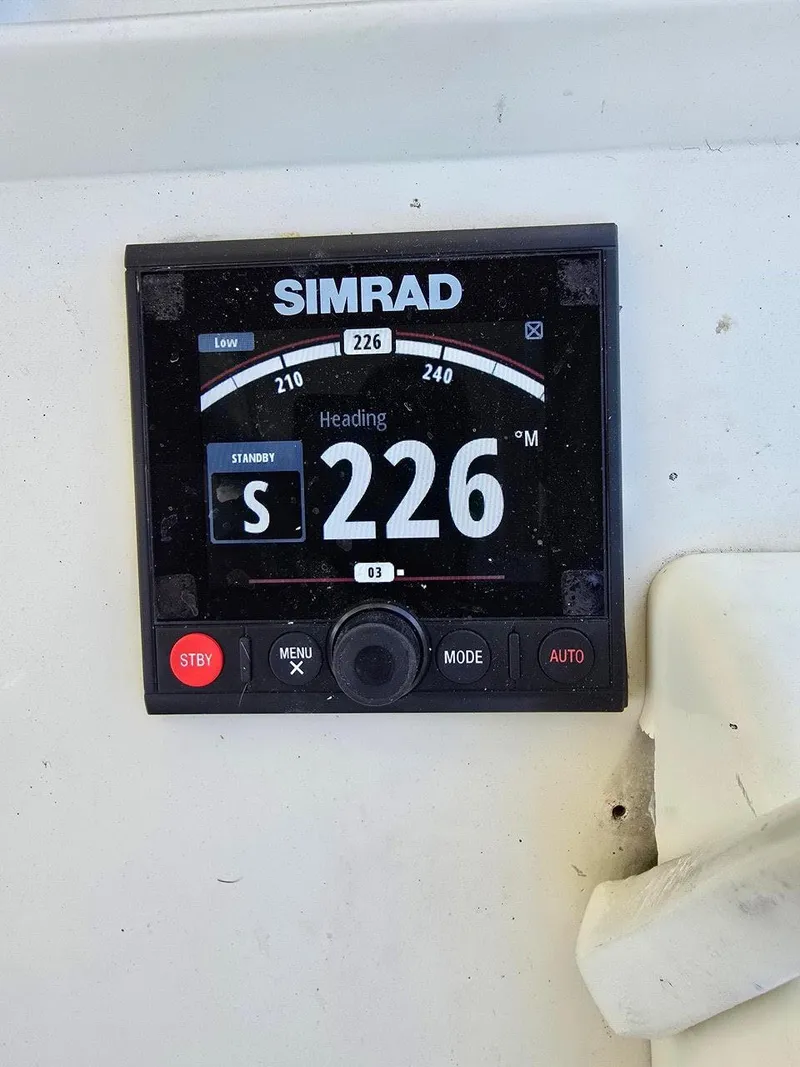 Slide: The Image of Simrad navigation display on 1990 Gulf Stream Yachts 31 Tournament, showing heading 226 degrees. - 32