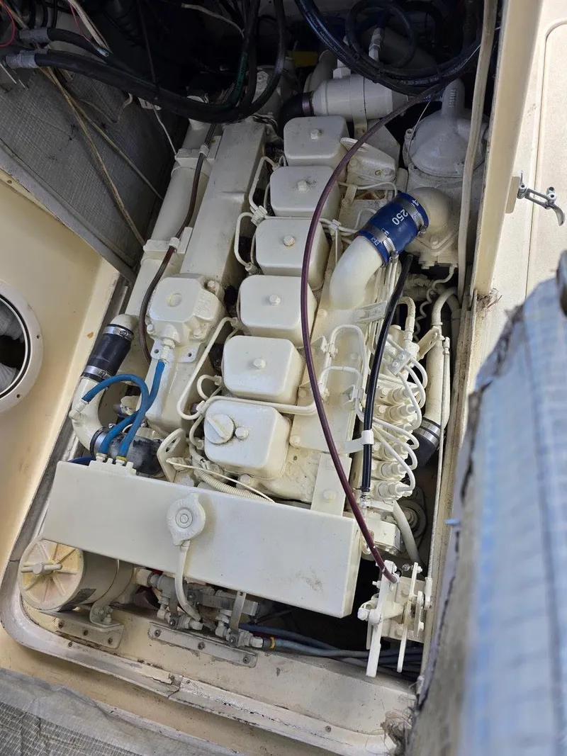 Slide: The Image of Engine compartment of a 1990 Gulf Stream Yachts 31 Tournament, showcasing detailed mechanical components. - 37