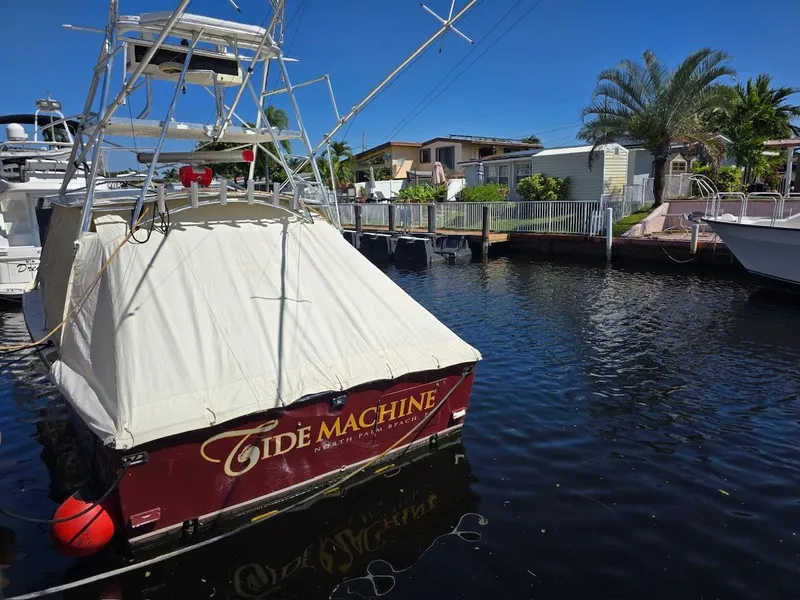 Slide: The Image of Gulf Stream Yachts 1990 model docked, covered, with "Tide Machine" name visible. - 39
