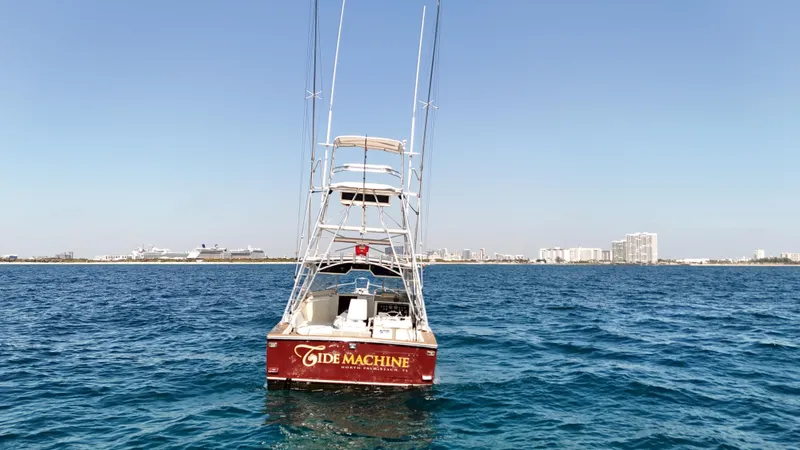 Slide: The Image of Gulf Stream Yachts 31 Tournament 1990 on open water, clear sky, distant cityscape. - 7