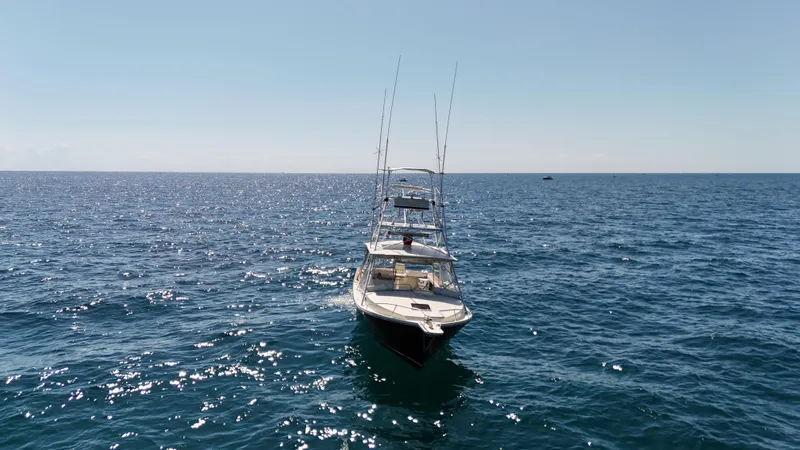 Slide: The Image of Gulf Stream Yachts 31 Tournament 1990 on open sea under clear sky. - 9