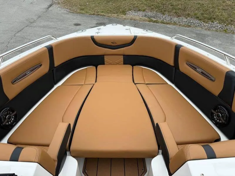 Slide: The Image of 2022 Chaparral 287 SSX boat interior with tan and black seating. - 11