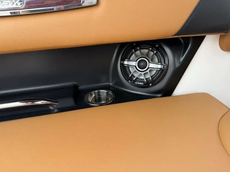 Slide: The Image of 2022 Chaparral 287 SSX interior detail with speaker and cup holder. - 15