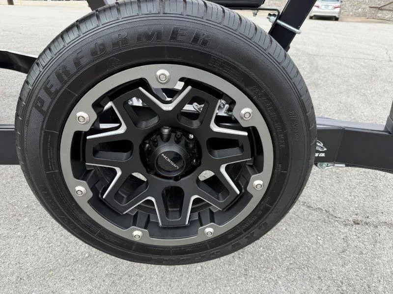 Slide: The Image of Black alloy wheel with "Performer" tire on a 2022 Chaparral 287 SSX. - 17