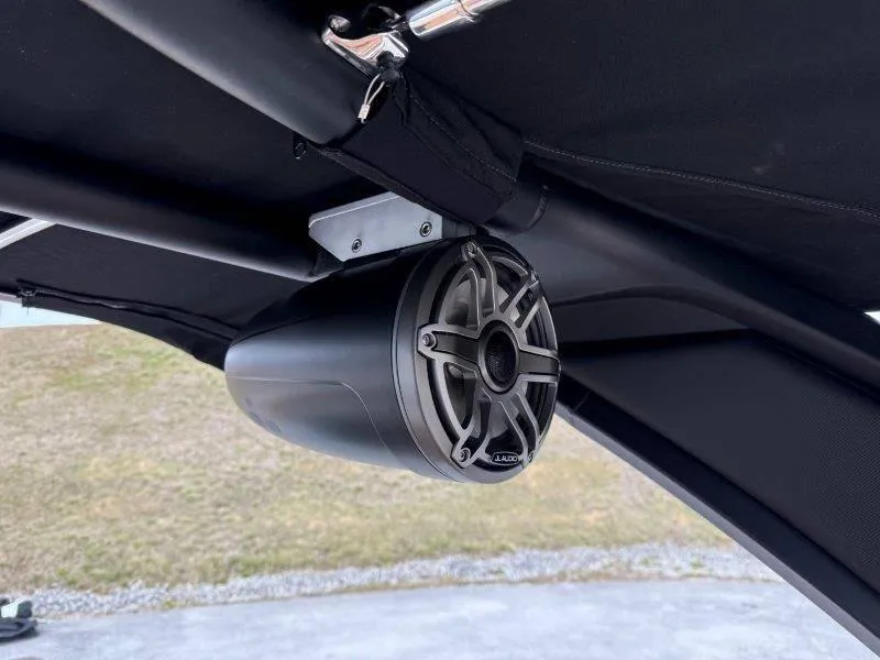 Slide: The Image of Speaker mounted on a 2022 Chaparral 287 SSX boat's canopy frame. - 19