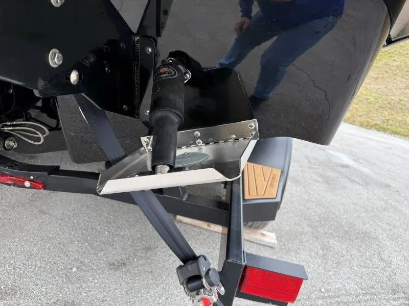 Slide: The Image of 2022 Chaparral 287 SSX boat trim tab and actuator detail. - 20