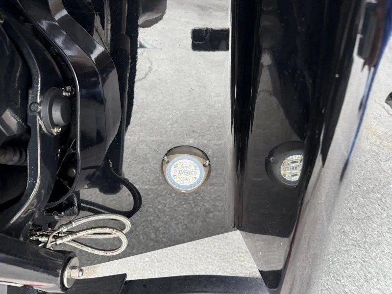 Slide: The Image of Close-up of 2022 Chaparral 287 SSX boat's black hull with underwater light. - 23