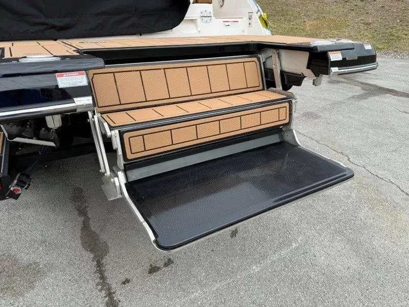 Slide: The Image of 2022 Chaparral 287 SSX boat swim platform with fold-out steps. - 25