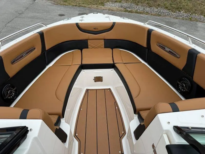 Slide: The Image of 2022 Chaparral 287 SSX boat interior with tan and black seating. - 31