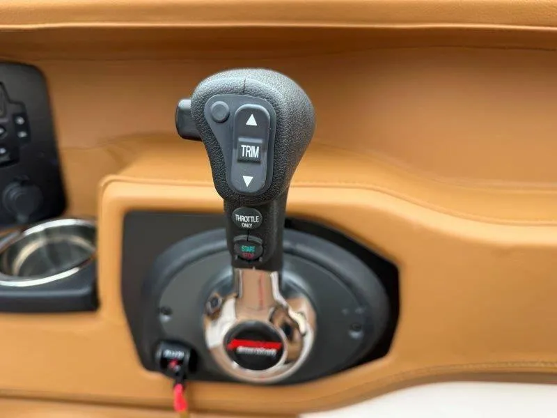 Slide: The Image of Throttle control lever on 2022 Chaparral 287 SSX boat dashboard. - 33