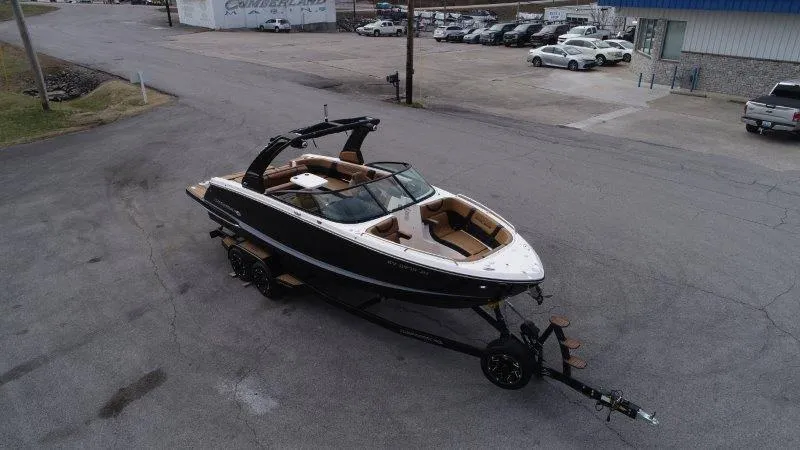 Slide: The Image of 2022 Chaparral 287 SSX boat on trailer in parking lot, aerial view. - 4