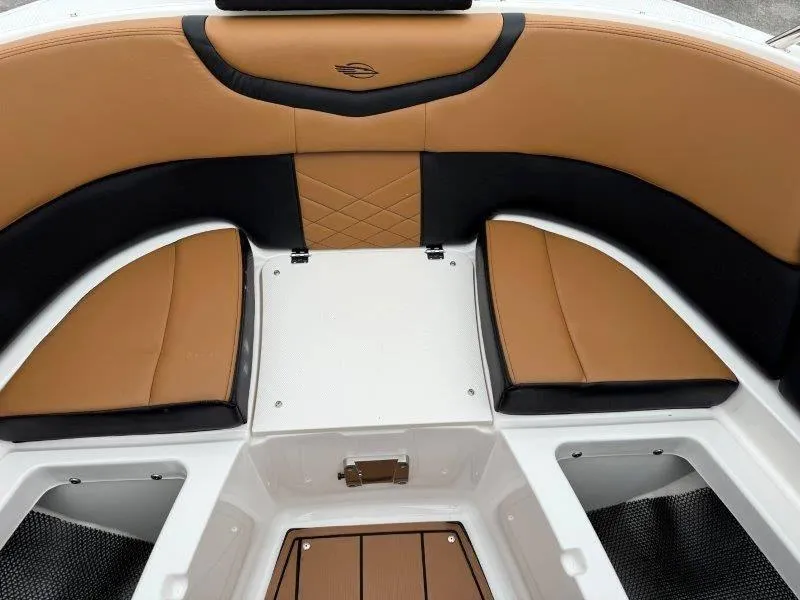 Slide: The Image of 2022 Chaparral 287 SSX boat interior with tan and black seating. - 43