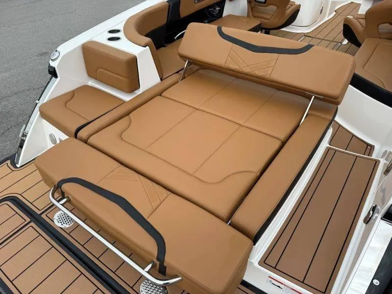 Slide: The Image of 2022 Chaparral 287 SSX boat with luxurious tan leather seating and sleek design. - 44