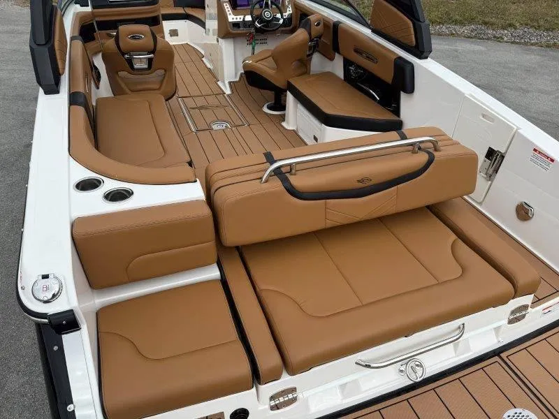 Slide: The Image of 2022 Chaparral 287 SSX boat interior with tan leather seating and modern design. - 46