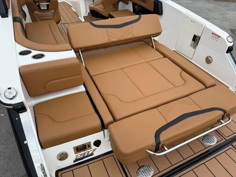 Slide: The Image of 2022 Chaparral 287 SSX boat interior with tan leather seating and modern design. - 48